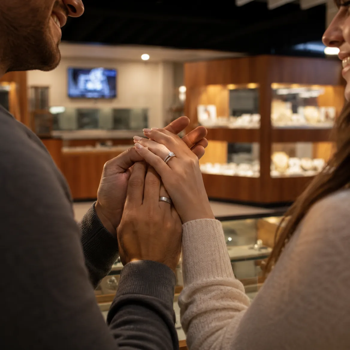 A couple with the jeweller during a consultation in the showroom